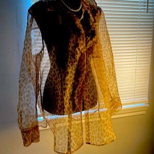 This Rachel Zoe Sheer Blouse in leopard print is soft and feminine